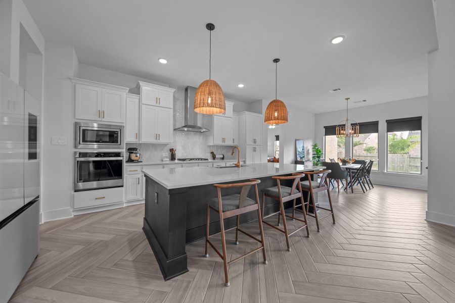 Great storage space in the kitchen with large island seating and open dining area. Designed for both everyday living and entertaining. Great storage space in the kitchen with large island seating and open dining area. Designed for both everyday living and entertaining.