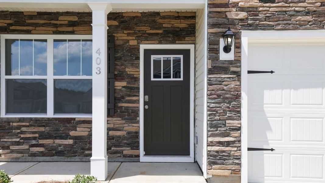Exterior details and patio area of a home in Durbin Meadows Traditions, Fountain Inn (Image 3).