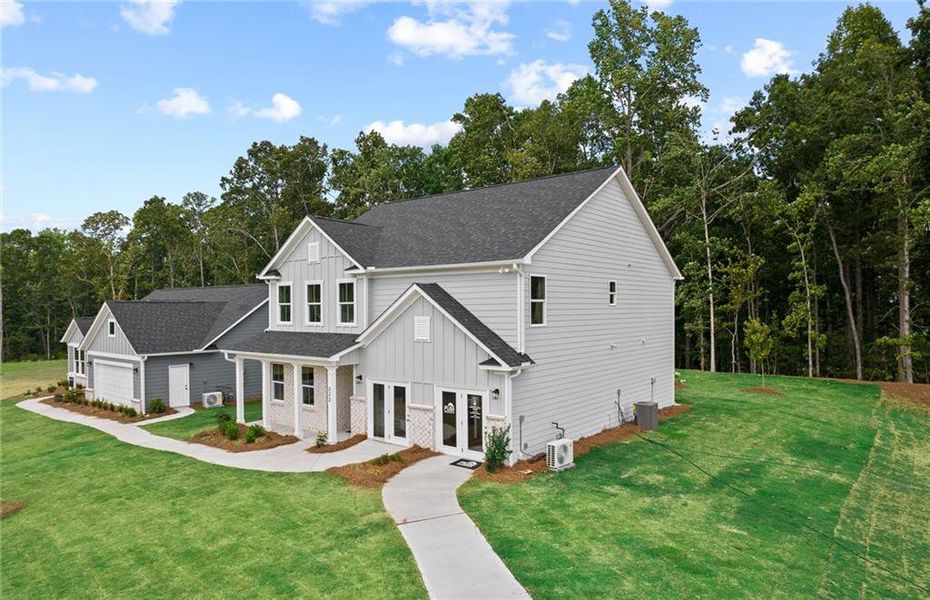 Front exterior of a new home in Watermist at Mirror Lake, Villa Rica, GA, highlighting curb appeal (Image 23).