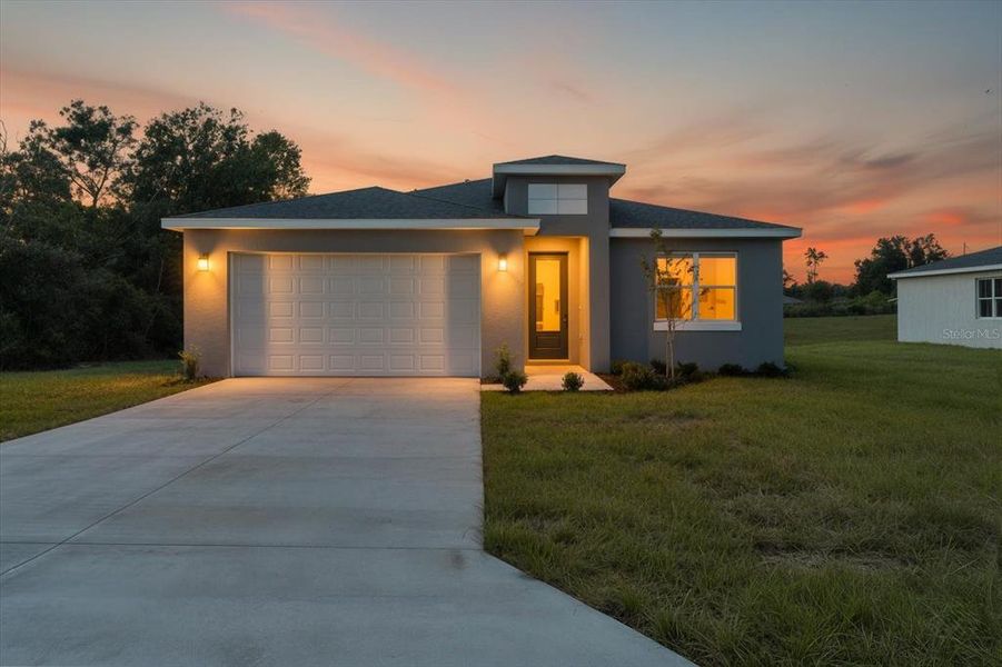 Front exterior of a new home in , Ocala, FL, highlighting curb appeal (Image 1). Front exterior of a new home in , Ocala, FL, highlighting curb appeal (Image 1).