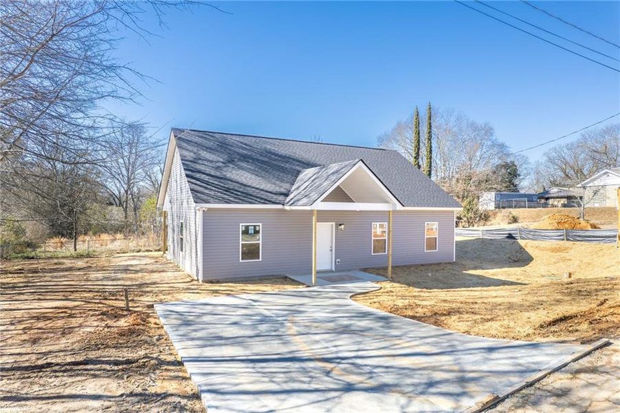 Front exterior of a new home in , Toccoa, GA, highlighting curb appeal (Image 1). Front exterior of a new home in , Toccoa, GA, highlighting curb appeal (Image 1).