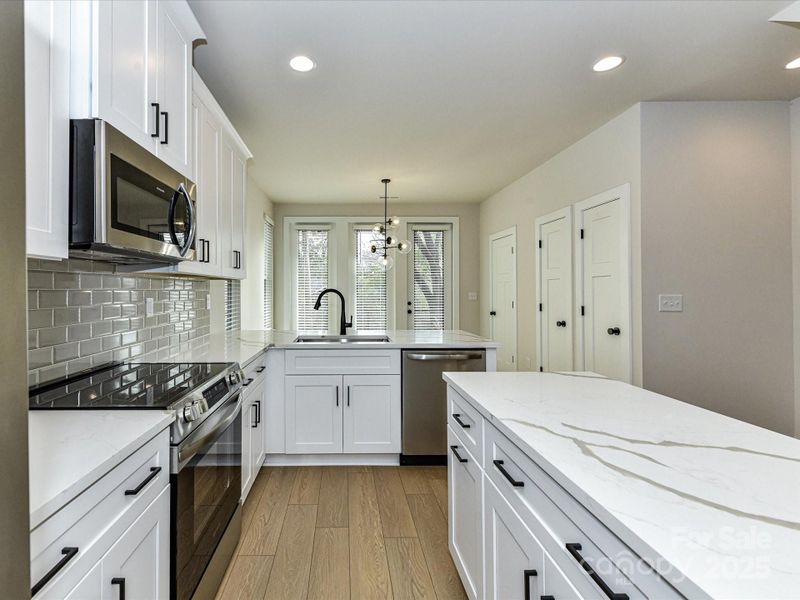 Furnished interior view inside a new home in North End Terraces, Charlotte (Image 9).