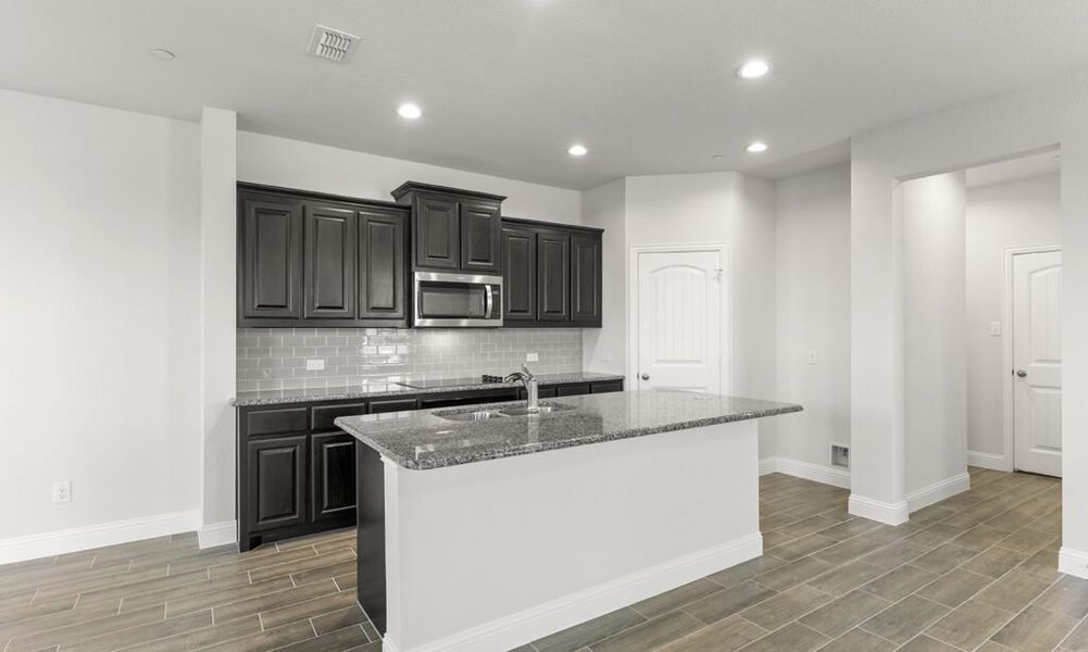 Representative exterior photo of a completed home built from the Granbury by Impression Homes in Main Street Village, Mansfield, TX (Image 6). Representative exterior photo of a completed home built from the Granbury by Impression Homes in Main Street Village, Mansfield, TX (Image 6).