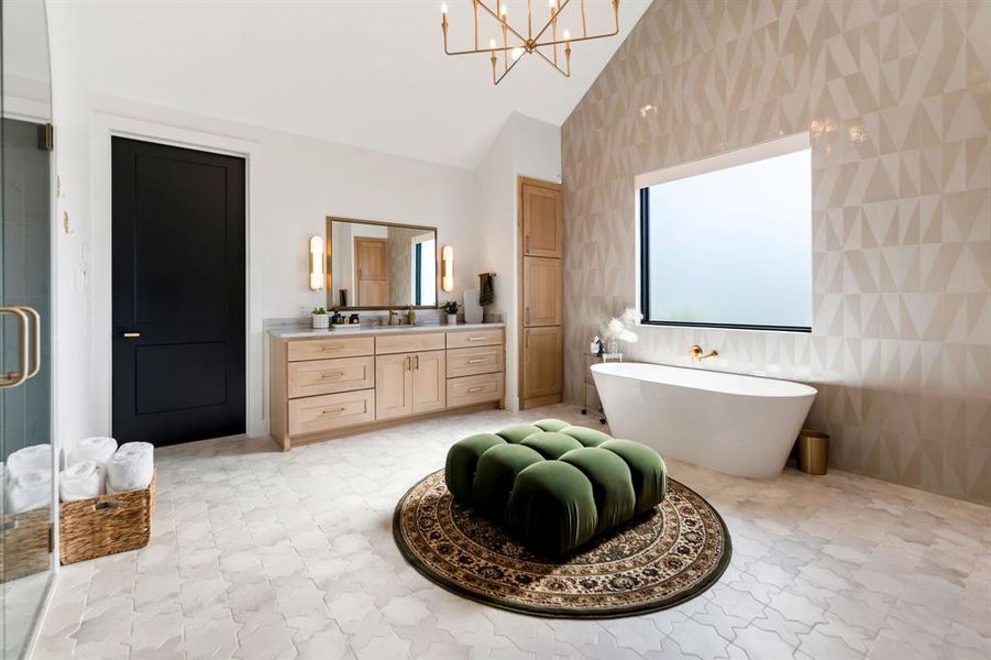 Bathroom with vanity, tile walls, a freestanding tub, a shower stall, and lofted ceiling Bathroom with vanity, tile walls, a freestanding tub, a shower stall, and lofted ceiling