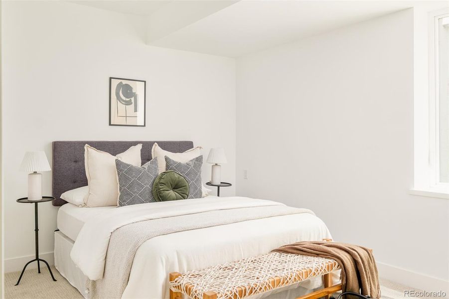 The main floor offers two bedrooms, perfect for guests or home offices