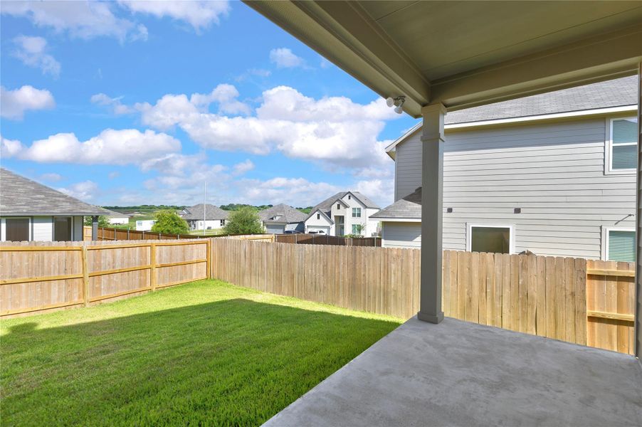 Exterior details and patio area of a home in Vintage Farms, Brenham (Image 27).