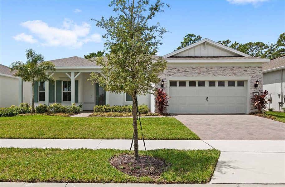 Front exterior of a new home in , Winter Garden, FL, highlighting curb appeal (Image 2). Front exterior of a new home in , Winter Garden, FL, highlighting curb appeal (Image 2).