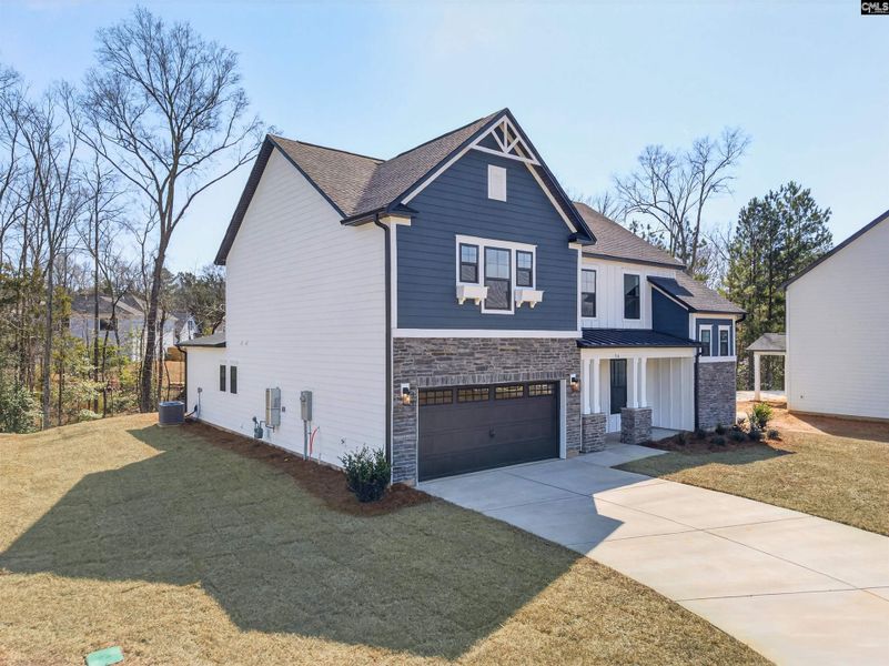 Front exterior of a new home in Collins Cove, Chapin, SC, highlighting curb appeal (Image 24).