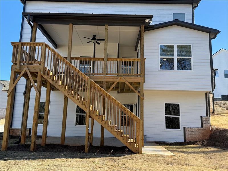 Exterior details and patio area of a home in River Rock, Ball Ground (Image 29).