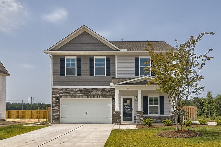 Front exterior of a new home in Blythewood Farms, Blythewood, SC, highlighting curb appeal (Image 1). Front exterior of a new home in Blythewood Farms, Blythewood, SC, highlighting curb appeal (Image 1).
