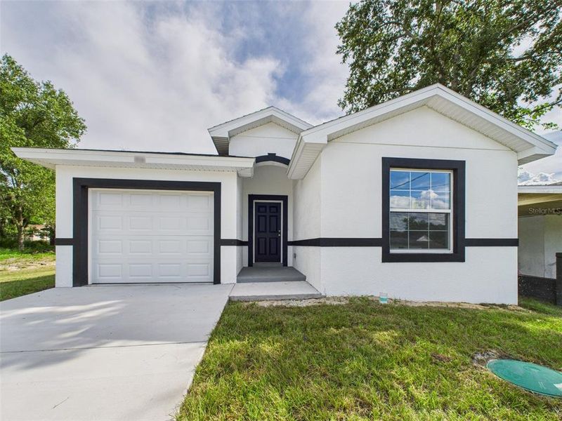 Front exterior of a new home in , Lakeland, FL, highlighting curb appeal (Image 29).