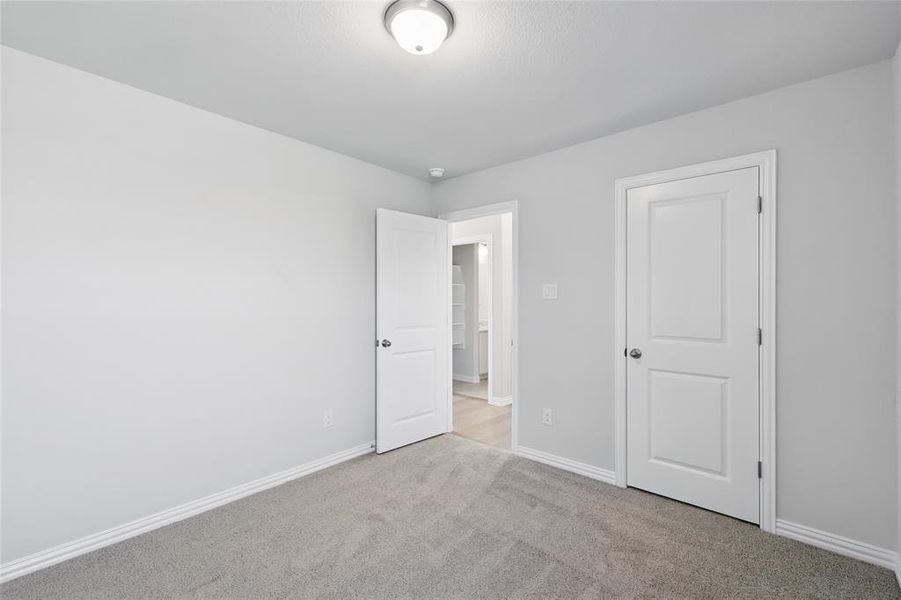 Unfurnished bedroom featuring carpet and baseboards Unfurnished bedroom featuring carpet and baseboards