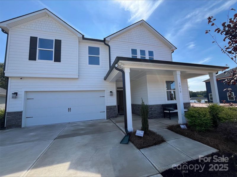 Exterior details and patio area of a home in Sheffield, Indian Trail (Image 24).