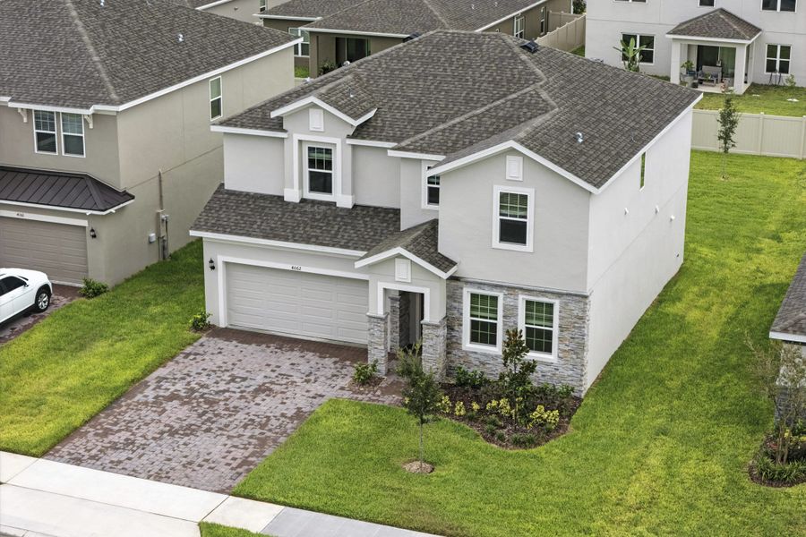 Front exterior of a new home in Lake Lincoln, Eustis, FL, highlighting curb appeal (Image 1).