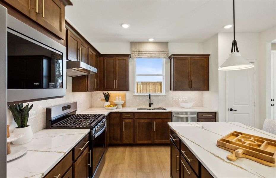 High-end gourmet kitchen with premium finishes and upgraded appliances *Model representation High-end gourmet kitchen with premium finishes and upgraded appliances *Model representation