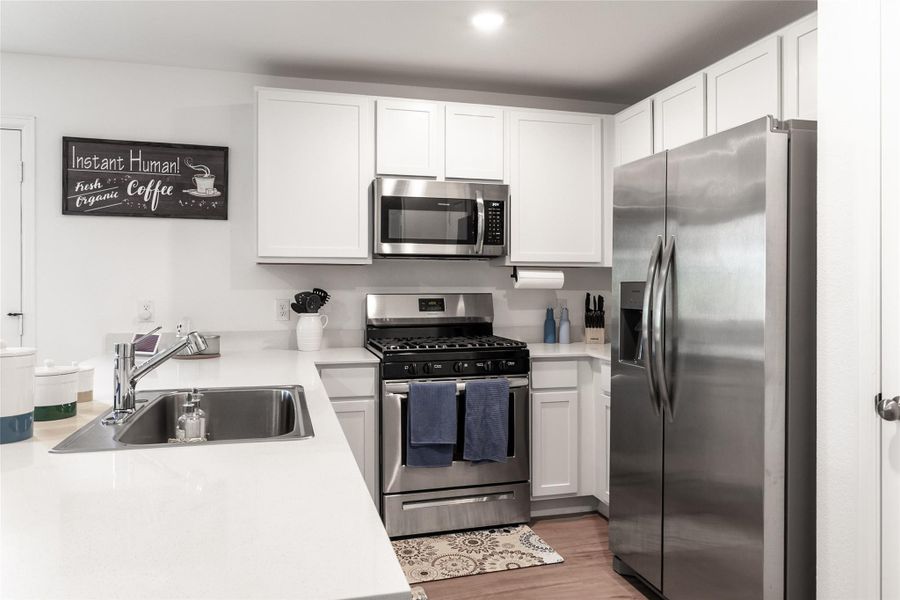 Furnished interior view inside a new home in Burnet Fields at Baytown Crossings, Baytown (Image 4). Furnished interior view inside a new home in Burnet Fields at Baytown Crossings, Baytown (Image 4).