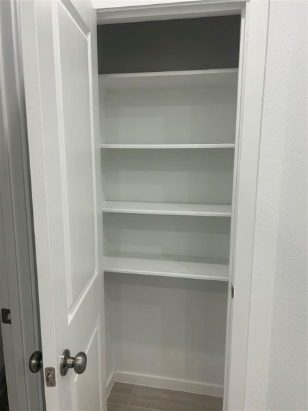 The linen Closet in the master bathroom features large shelves. The linen Closet in the master bathroom features large shelves.