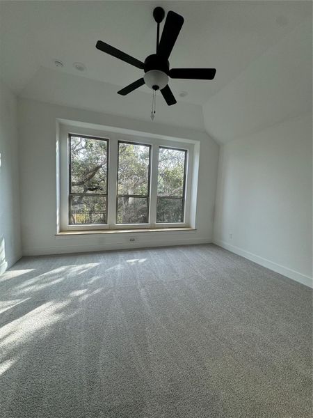 Primary Bedroom with a High Ceiling