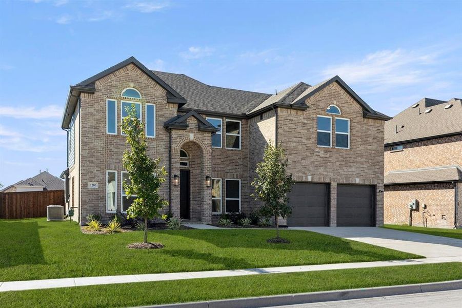 Front exterior of a new home in Grayhawk Addition, Forney, TX, highlighting curb appeal (Image 2). Front exterior of a new home in Grayhawk Addition, Forney, TX, highlighting curb appeal (Image 2).