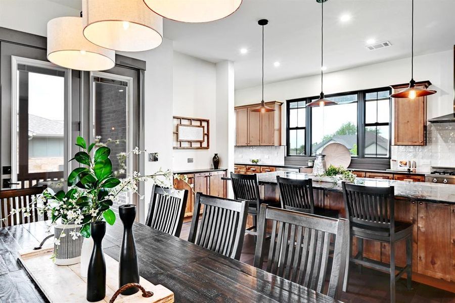 Dining area with recessed lighting and wood finished floors