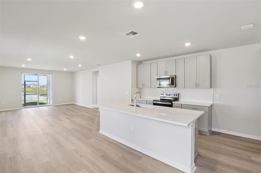 Furnished interior view inside a new home in Crescent Lakes - Premier Series, Punta Gorda (Image 6).