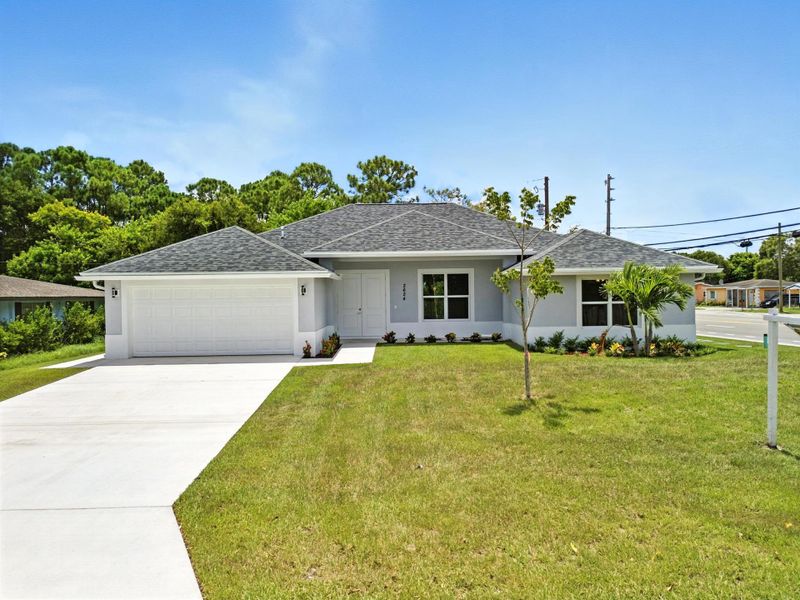 Front exterior of a new home in , Fort Pierce, FL, highlighting curb appeal (Image 18).