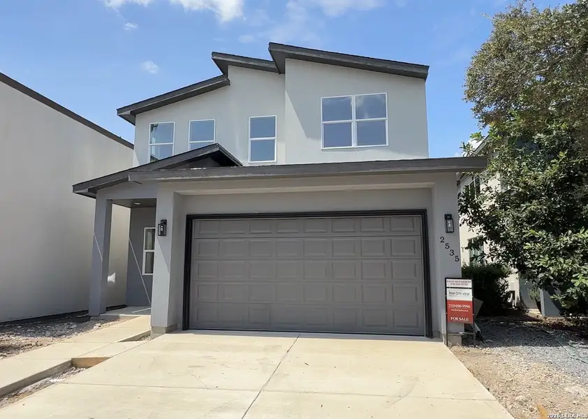Front exterior of a new home in , San Antonio, TX, highlighting curb appeal (Image 1). Front exterior of a new home in , San Antonio, TX, highlighting curb appeal (Image 1).