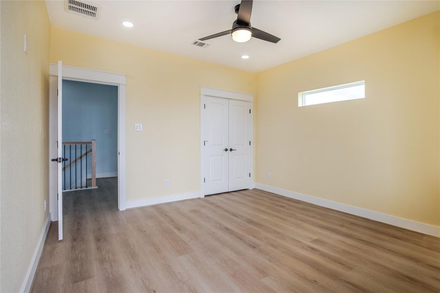Beautiful flooring, private closet, modern ceiling fan and a great window for natural light.