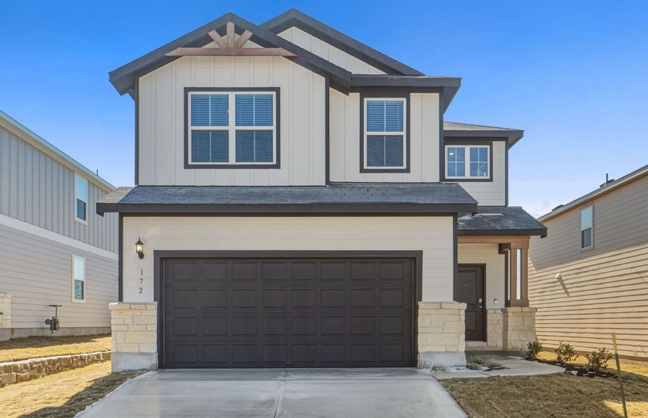 Front exterior of a new home in Sunfield, Buda, TX, highlighting curb appeal (Image 22).