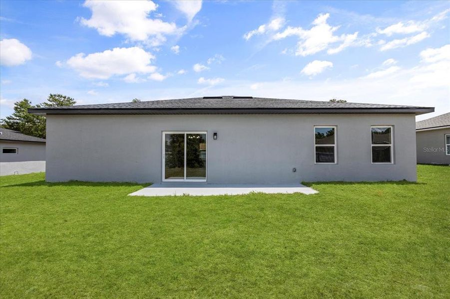 Front exterior of a new home in , Ocala, FL, highlighting curb appeal (Image 2). Front exterior of a new home in , Ocala, FL, highlighting curb appeal (Image 2).