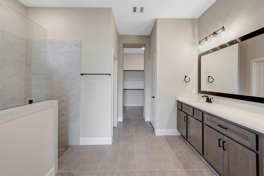 Furnished interior view inside a new home in COLTON - Reserve Collection, Todd Mission (Image 19).