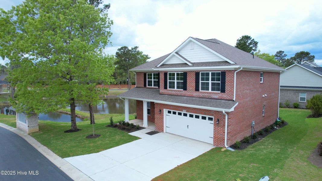 Front exterior of a new home in Palmetto Creek, Bolivia, NC, highlighting curb appeal (Image 17).