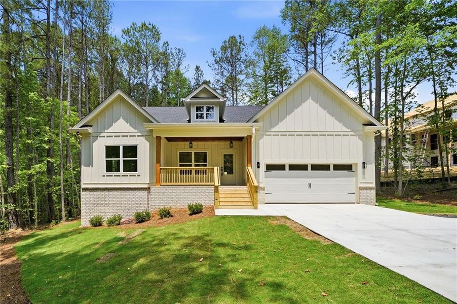 Front exterior of a new home in Autumn Brook, Canton, GA, highlighting curb appeal (Image 1). Front exterior of a new home in Autumn Brook, Canton, GA, highlighting curb appeal (Image 1).