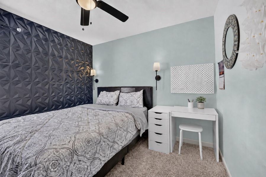 Another view of the secondary bedroom showcasing its comfortable proportions and versatile layout. Another view of the secondary bedroom showcasing its comfortable proportions and versatile layout.