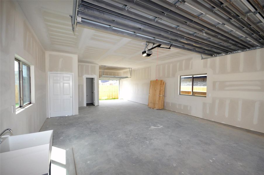 First floor of garage 2 includes another utility sink and a 2 piece bath.