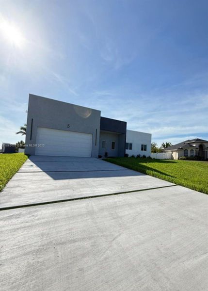 Front exterior of a new home in , Cape Coral, FL, highlighting curb appeal (Image 20).