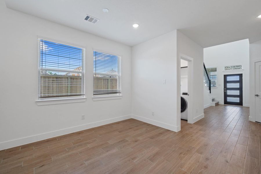 Representative unfurnished interior of a home built from the Sage by Chesmar Homes in Sunterra, Katy (Image 7).