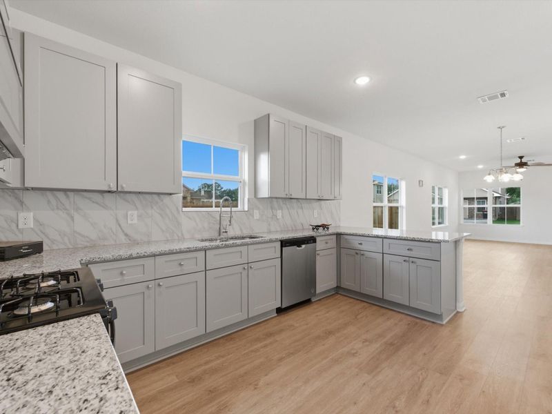 Designed to keep life connected, this inviting kitchen creates a natural gathering place for conversation, meals, and everyday memories.