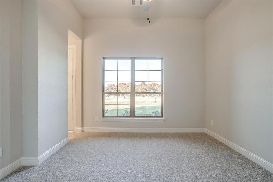 Spare room featuring light colored carpet