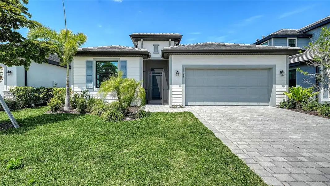 Front exterior of a new home in , Venice, FL, highlighting curb appeal (Image 27).