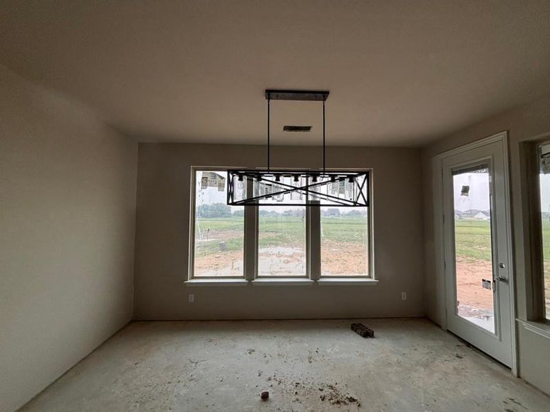 Rectangular chandelier with black finish, multiple windows, and a full-light exterior door