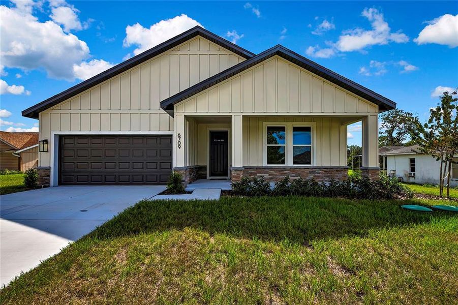 Front exterior of a new home in , Spring Hill, FL, highlighting curb appeal (Image 25).