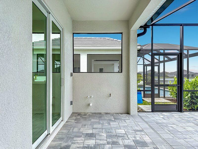 Exterior details and patio area of a home in River Preserve Estates, Parrish (Image 27).