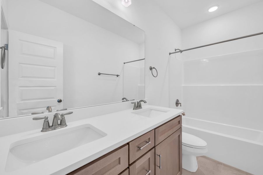 Representative furnished interior of a home built from the The Highland by RobuckHomes in Windwater, Hampstead (Image 15).