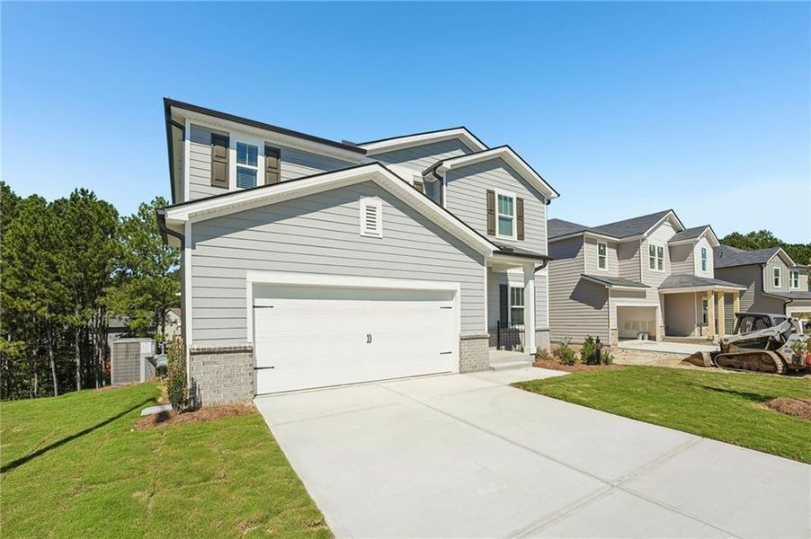 Front exterior of a new home in Ivey Township, Dallas, GA, highlighting curb appeal (Image 26).