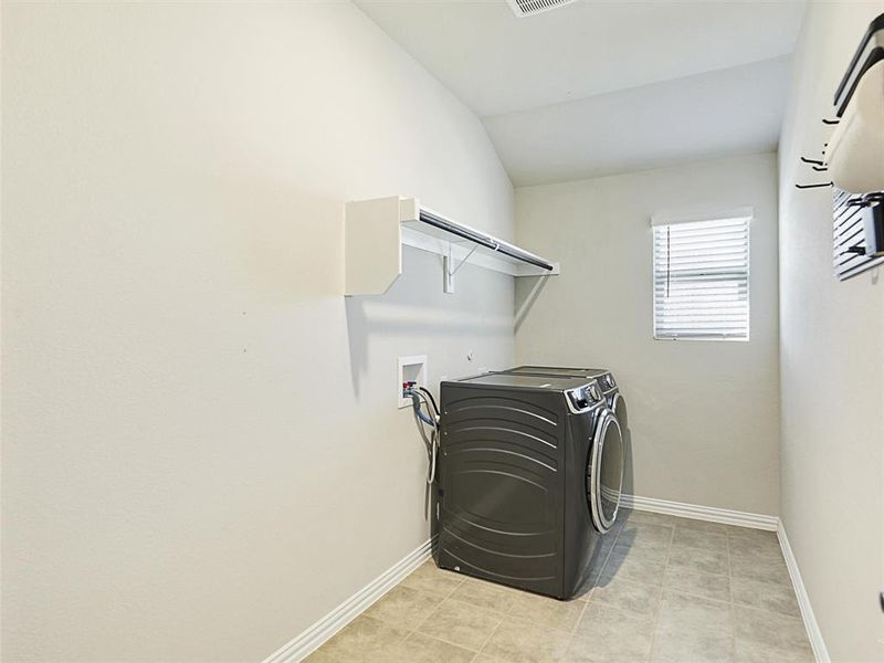 Clothes washing area with washer and clothes dryer