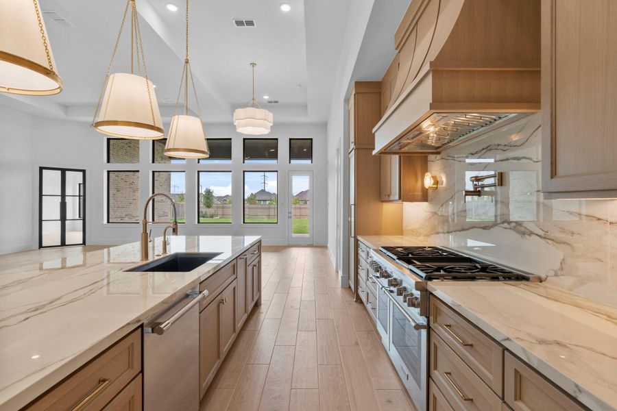 The open floor plan includes space for a breakfast area. Representative image.