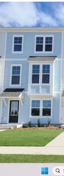 Front exterior of a new home in Westpark at Cane Bay, Summerville, SC, highlighting curb appeal (Image 1). Front exterior of a new home in Westpark at Cane Bay, Summerville, SC, highlighting curb appeal (Image 1).