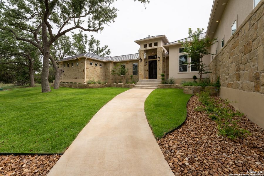 Front exterior of a new home in , Spring Branch, TX, highlighting curb appeal (Image 23).