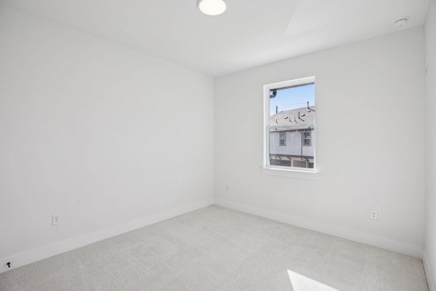 Spacious, unfurnished interior of a new home in Koenig Townhomes, Austin (Image 32).
